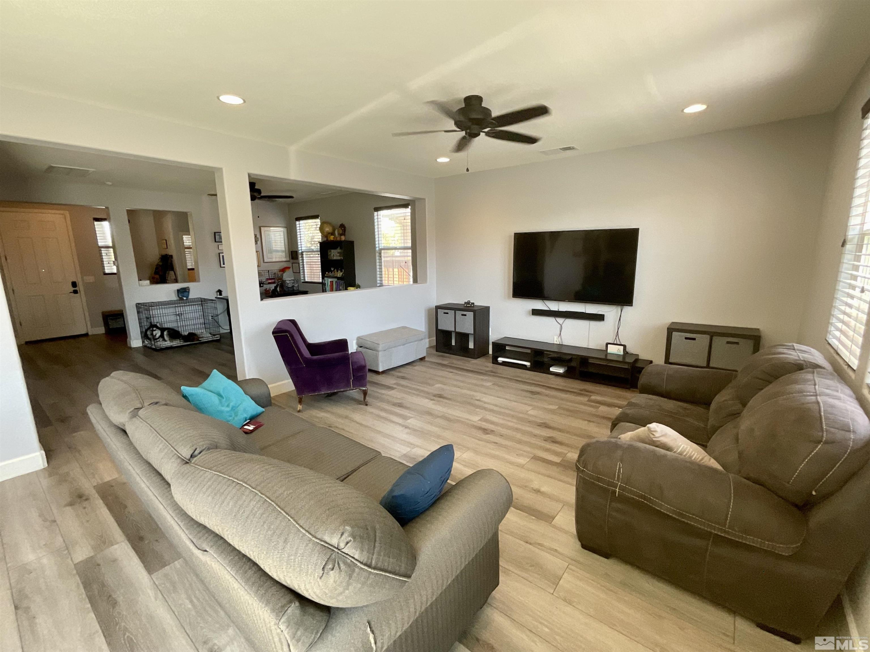 11640 Cervino Drive Reno, NV 89521 - Photo 6 of 26 a living room with furniture and a flat screen tv