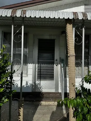 a front view of a house with a porch