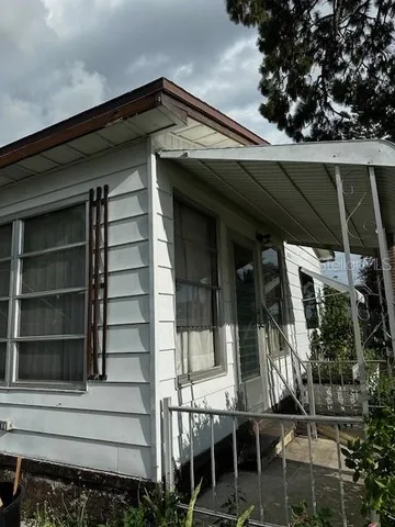 a front view of a house with a porch