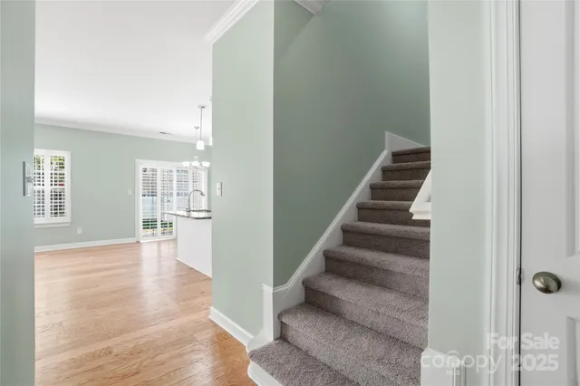 a view of an empty room with stairs