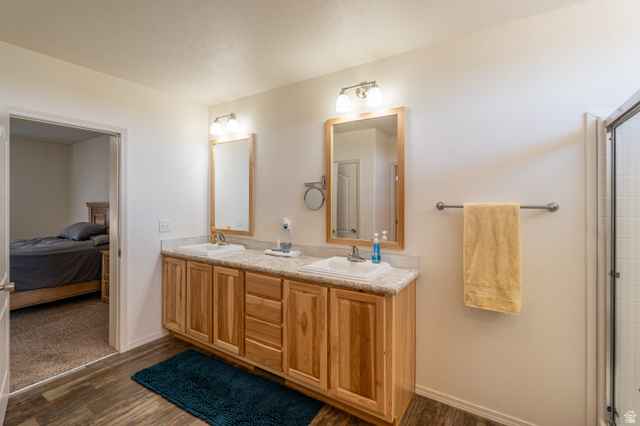 700 East Peter Springs Road Monticello, UT 84535 - Photo 21 of 57 Dual vanity with wood-finish cabinetry and light-toned countertops