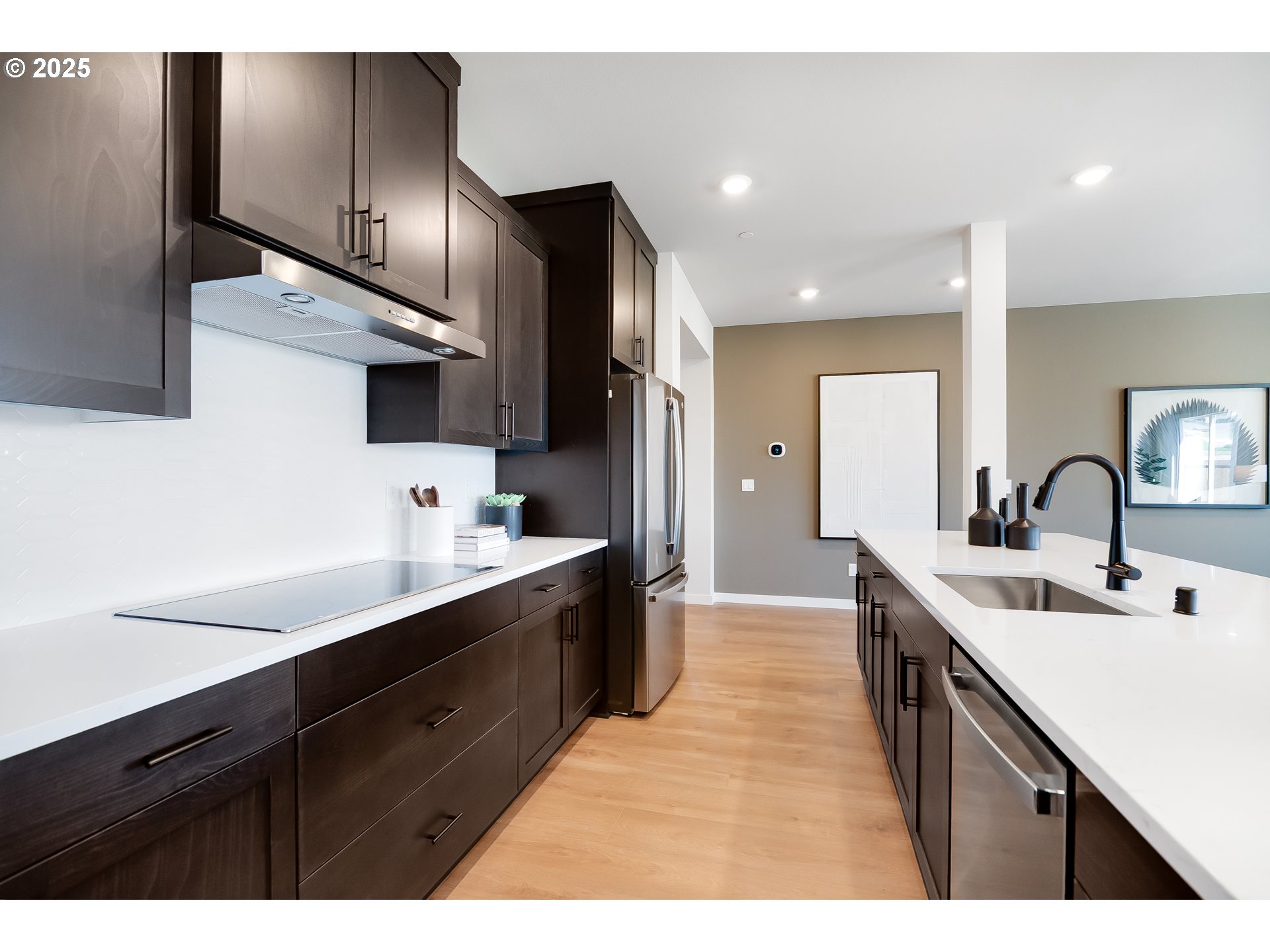 5562 North 88th Avenue Camas, WA 98607 - Photo 12 of 48 a kitchen with stainless steel appliances a sink stove and refrigerator