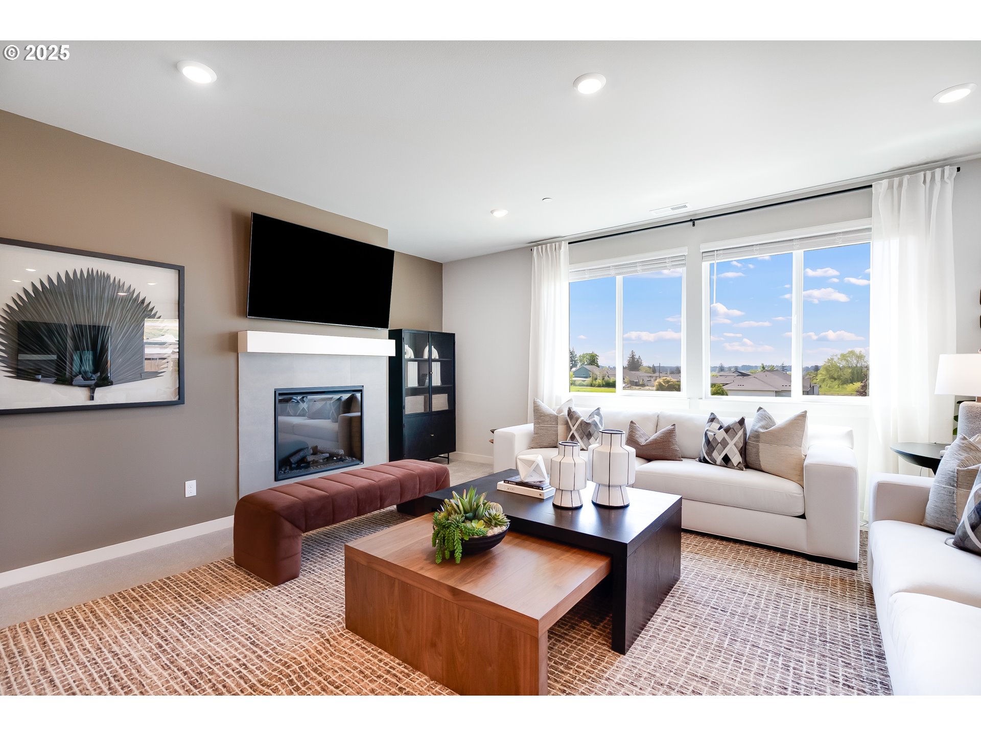 5562 North 88th Avenue Camas, WA 98607 - Photo 15 of 48 a living room with furniture a fireplace and a flat screen tv