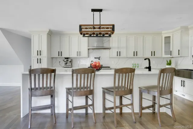 a bed sitting in a spacious bedroom next to a window