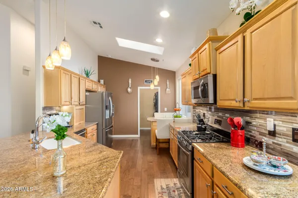 a kitchen with sink and stove