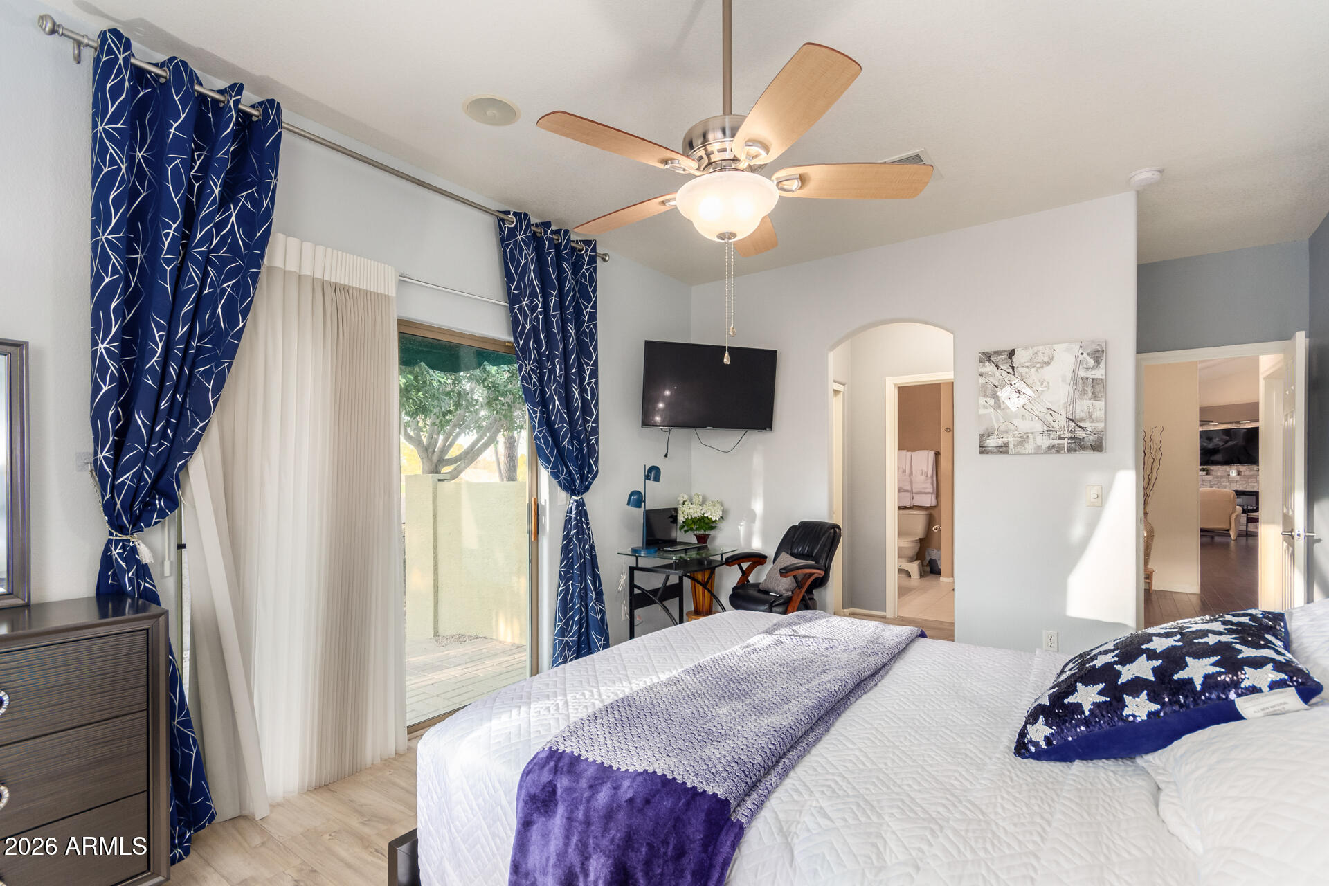 3341 East Fremont Road Phoenix, AZ 85042 - Photo 24 of 40 a bedroom with a bed and a chandelier