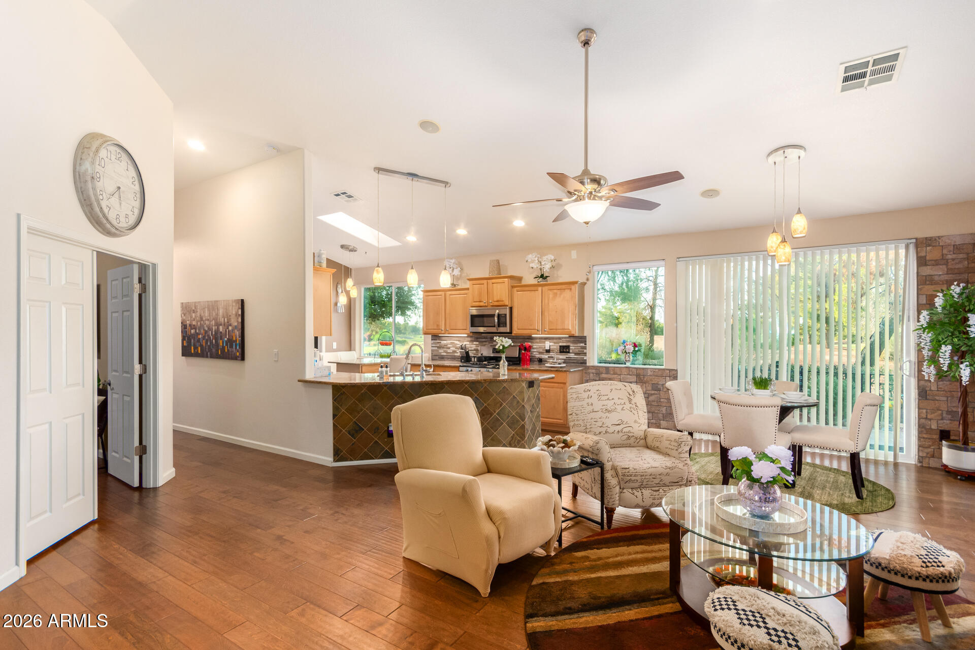 3341 East Fremont Road Phoenix, AZ 85042 - Photo 5 of 40 a living room with furniture a large window and a chandelier