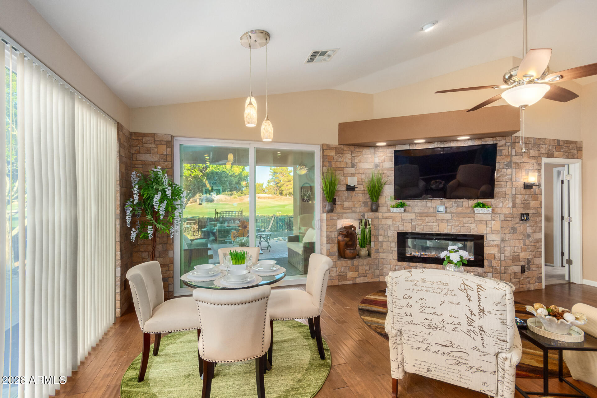 3341 East Fremont Road Phoenix, AZ 85042 - Photo 8 of 40 a view of a dining room with furniture wooden floor and chandelier