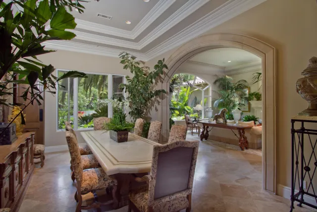 a view of an outdoor dining space with a table and chairs