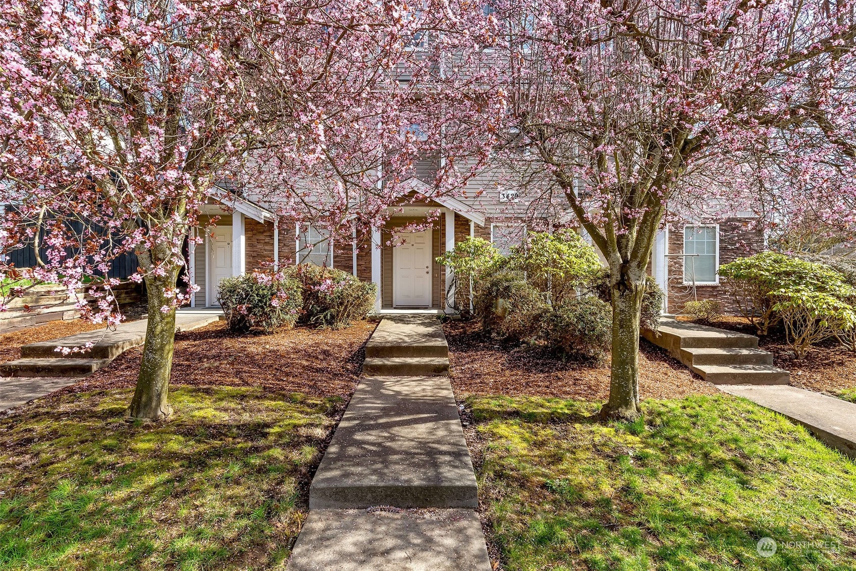 3429 Wetmore Avenue Everett, WA 98201 - Photo 14 of 19 a front view of a house with garden