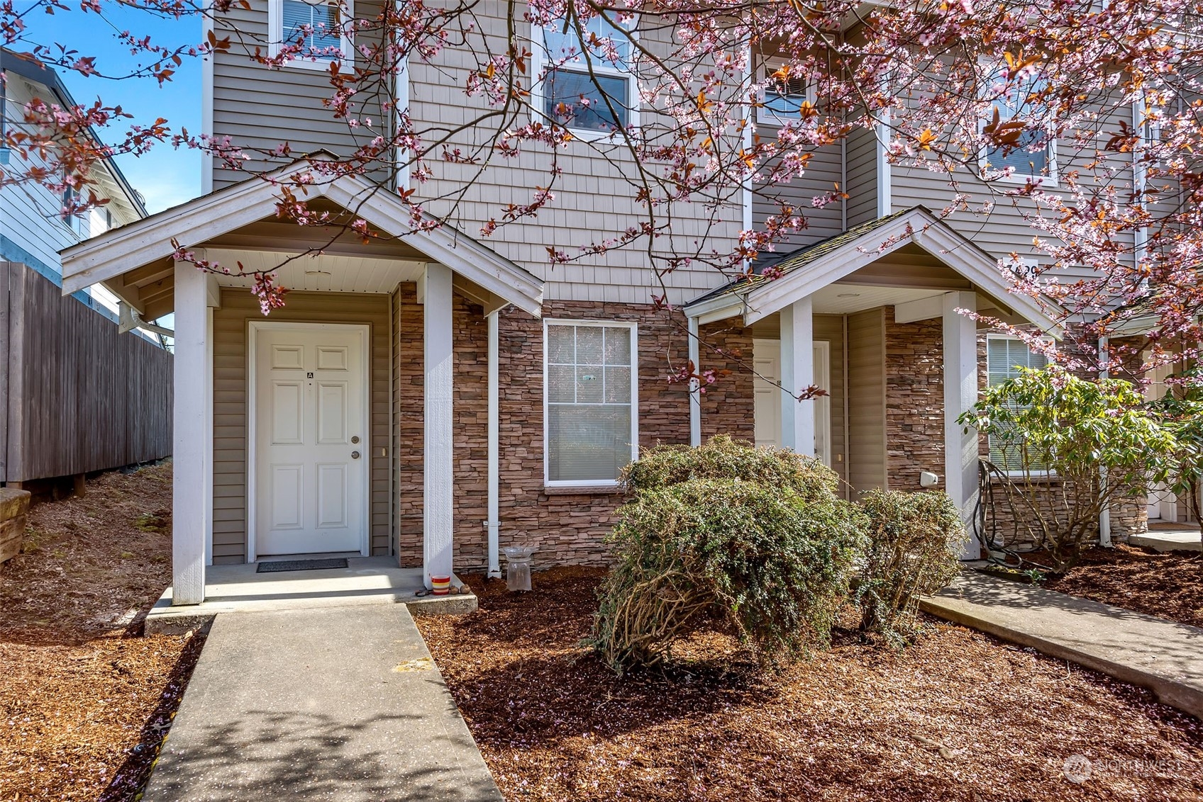 3429 Wetmore Avenue Everett, WA 98201 - Photo 15 of 19 a front view of a house with garden