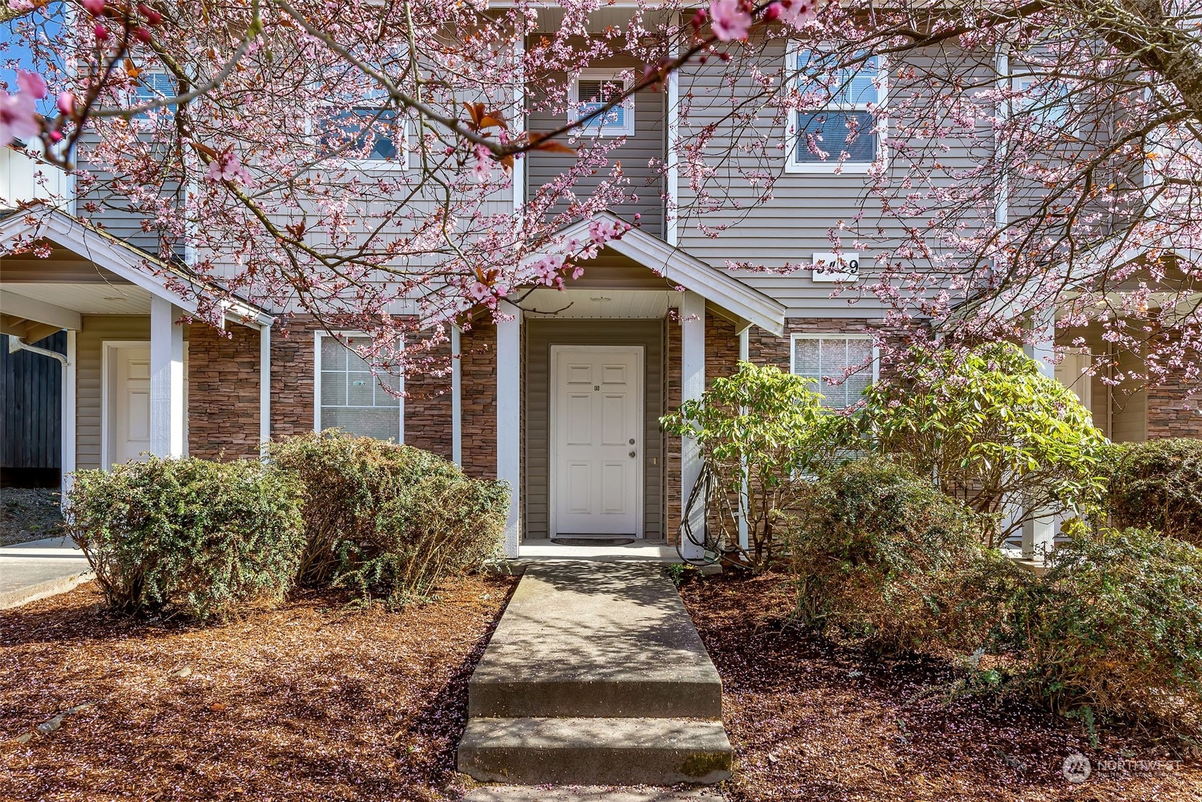 3429 Wetmore Avenue Everett, WA 98201 - Photo 2 of 19 a front view of a house with garden
