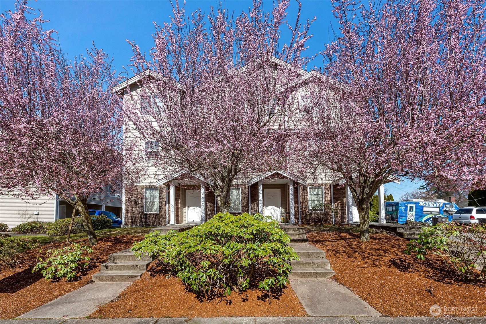3429 Wetmore Avenue Everett, WA 98201 - Photo 4 of 19 a front view of a house with a garden