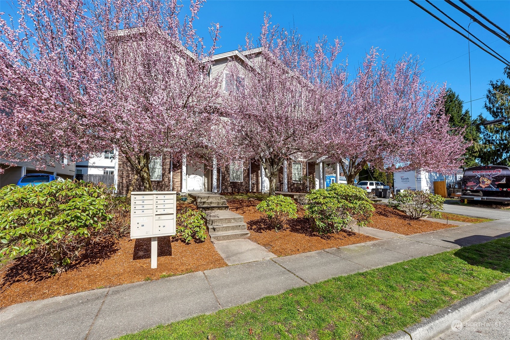 3429 Wetmore Avenue Everett, WA 98201 - Photo 5 of 19 a view of a building with a yard and tree s