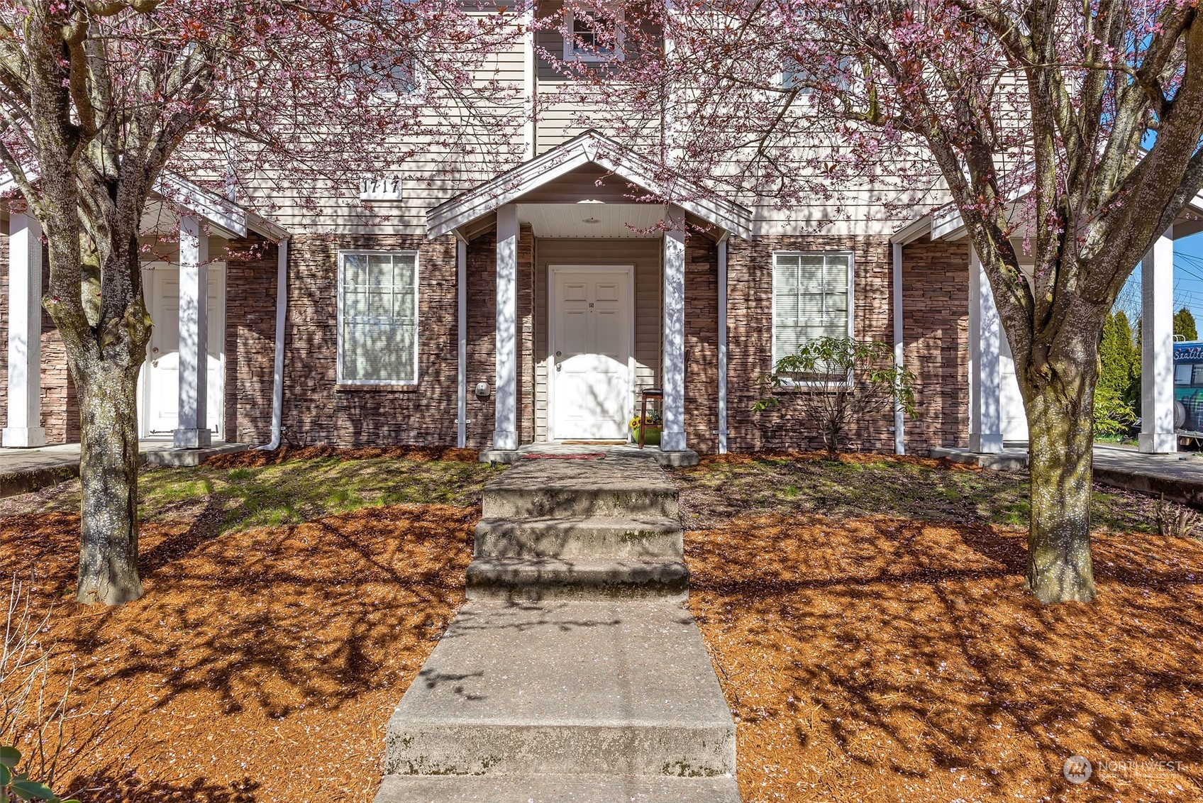 3429 Wetmore Avenue Everett, WA 98201 - Photo 9 of 19 a front view of a house with a large tree