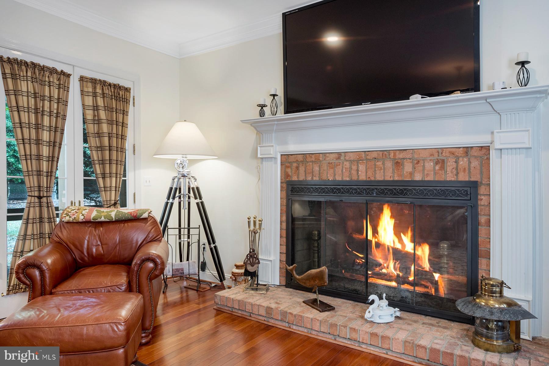 3057 Rundelac Road Annapolis, MD 21403 - Photo 18 of 61 Family room has a wood-burning fireplace
