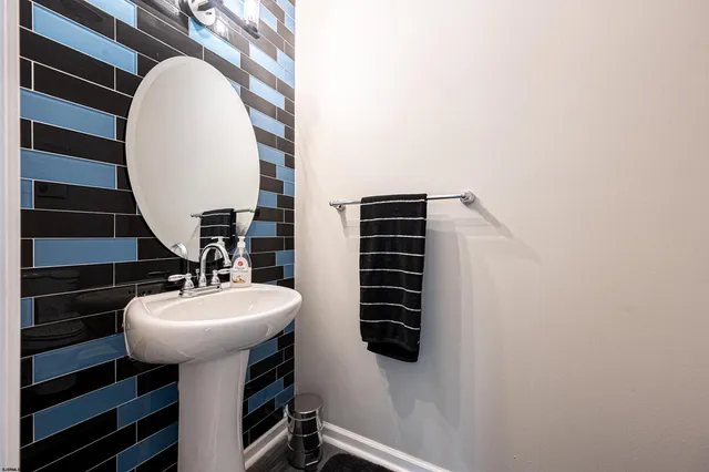 a bathroom with a sink a mirror and a toilet