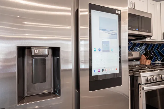 a view of a kitchen with an oven and a refrigerator