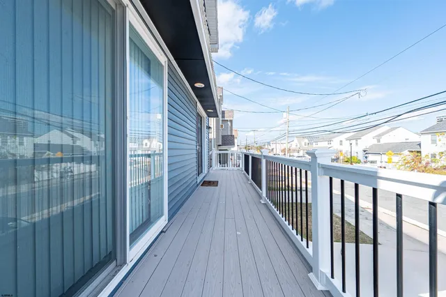 a view of balcony with wooden floor