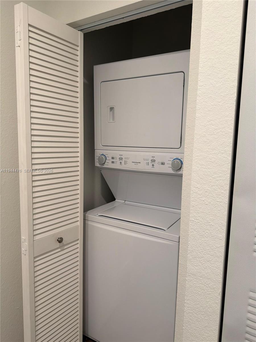13390 Southwest 251st Terrace, Unit 1 Homestead, FL 33032 - Photo 13 of 22 a utility room with dryer and washer