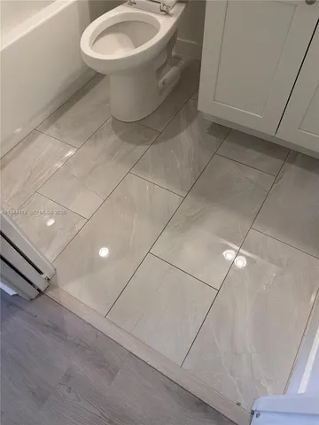 a bathroom with a toilet and a sink