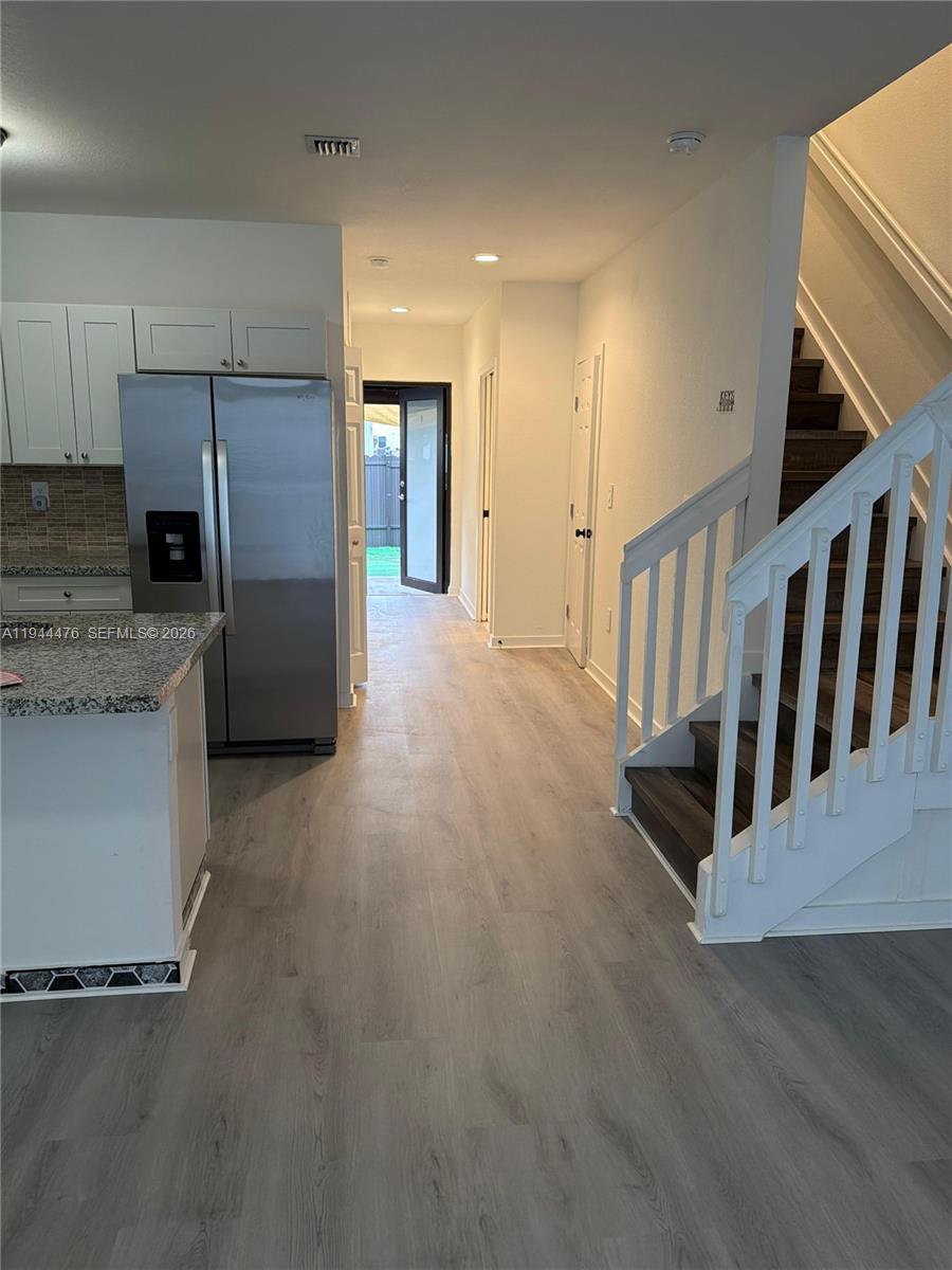 13390 Southwest 251st Terrace, Unit 1 Homestead, FL 33032 - Photo 19 of 22 a view of a kitchen with a sink fridge and window