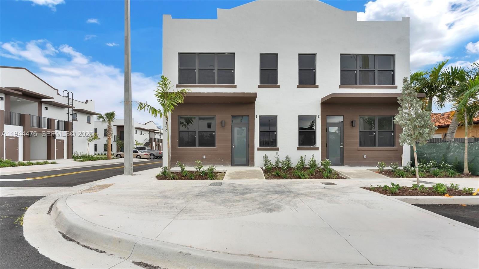 13390 Southwest 251st Terrace, Unit 1 Homestead, FL 33032 - Photo 2 of 22 a front view of a building with street view