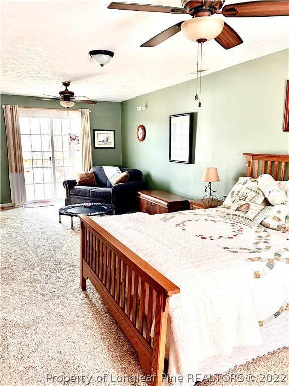 4481 Virsalli Loop Hope Mills, NC 28348 - Photo 13 of 24 a bedroom with a bed and a table