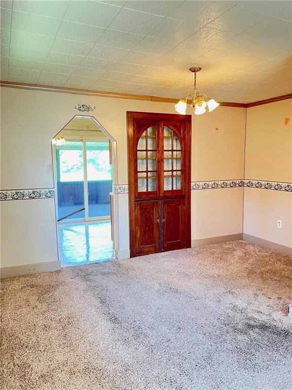445 Tevebaugh Hollow Road Freedom, PA 15042 - Photo 3 of 17 a view of an empty room with a window
