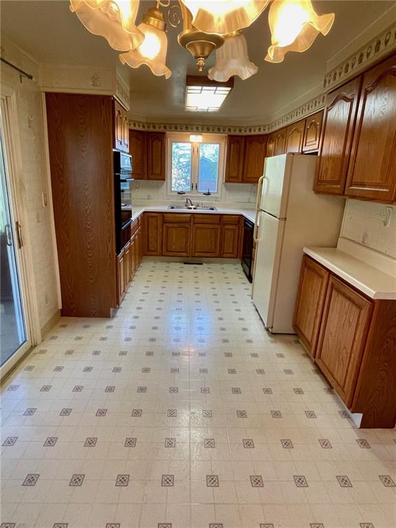 445 Tevebaugh Hollow Road Freedom, PA 15042 - Photo 6 of 17 a large kitchen with cabinets and a wooden floor