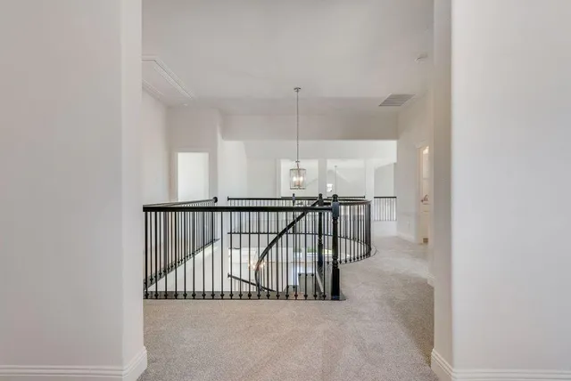a view of a hallway with staircase