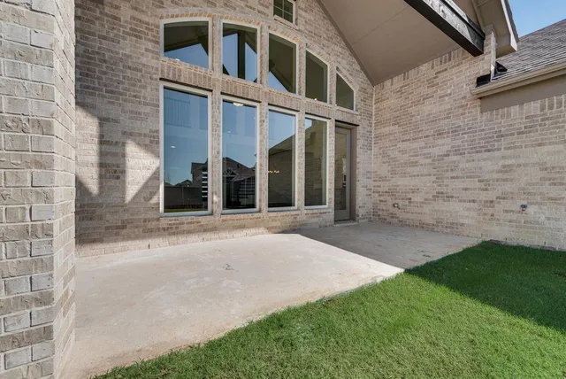 an aerial view of a house with a lake view