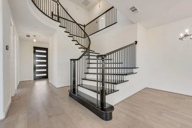 a view of entryway with wooden floor