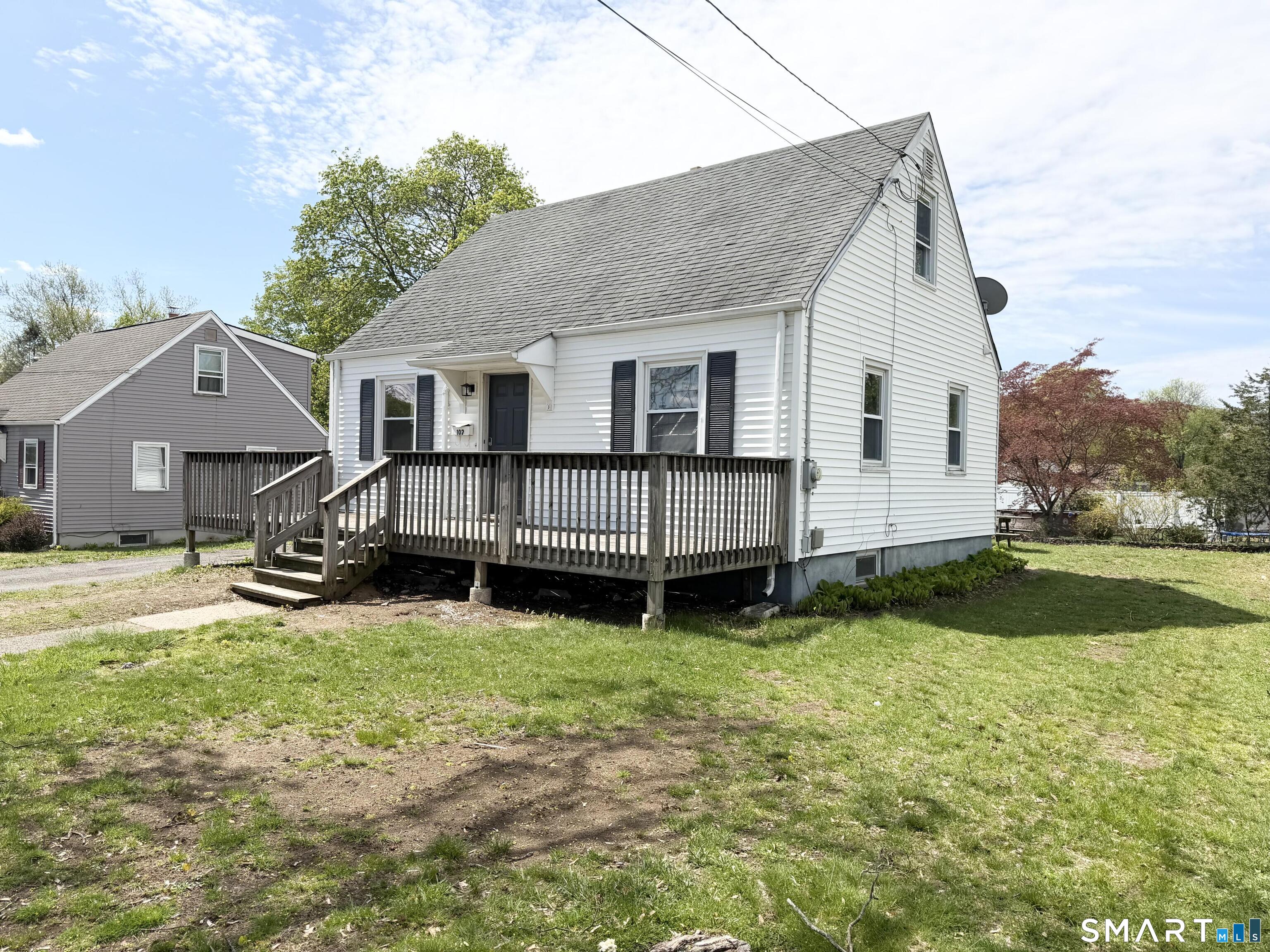 102 Benham Street Bristol, CT 06010 - Photo 2 of 17 a view of a house with a yard and a fence