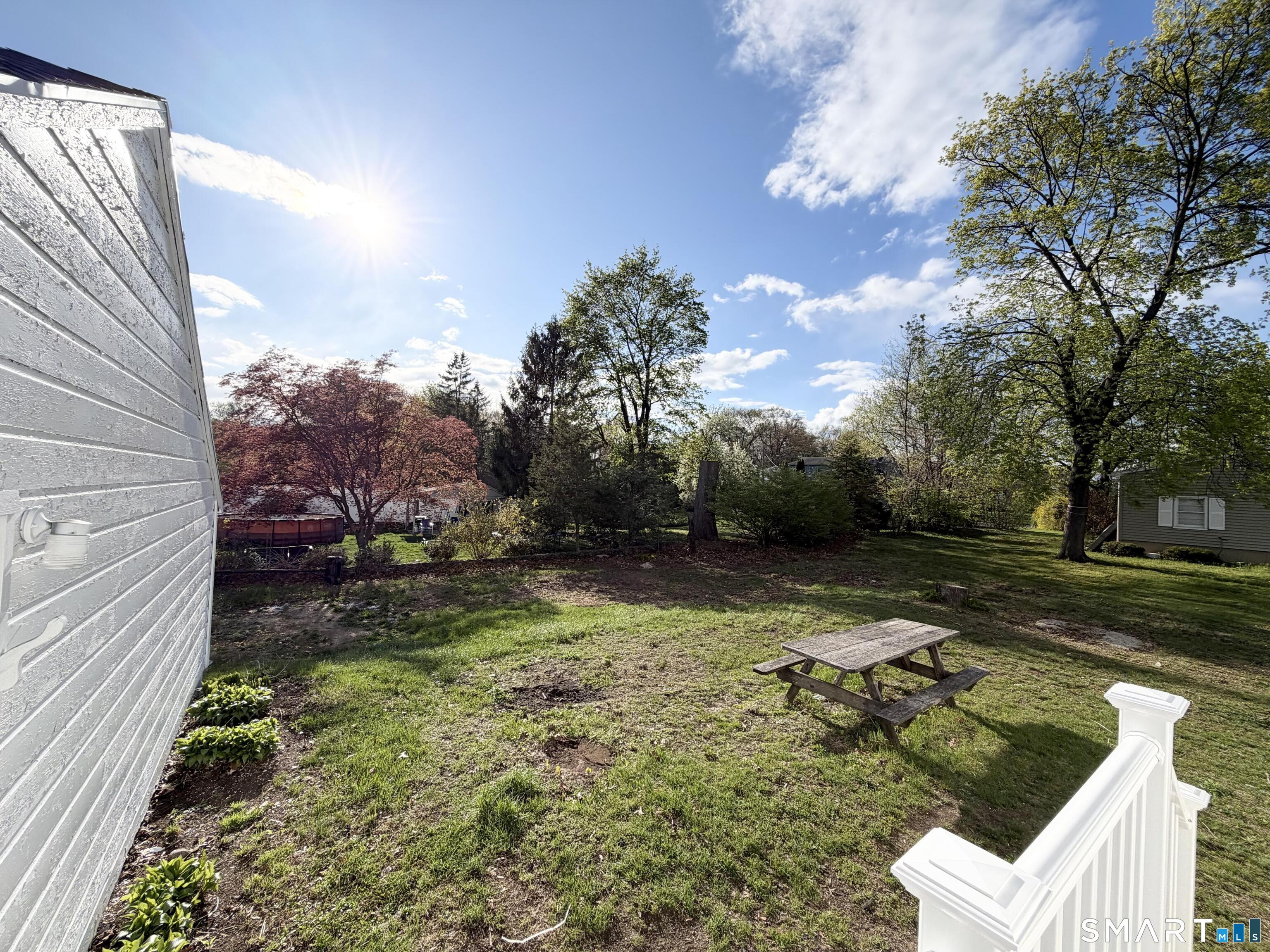 102 Benham Street Bristol, CT 06010 - Photo 4 of 17 a view of a yard with plants