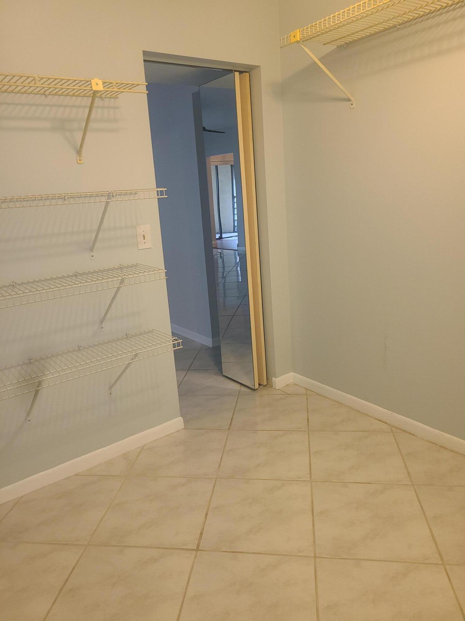 6328 Longboat Lane West, Unit 201 Boca Raton, FL 33433 - Photo 7 of 17 6328 Longboat Walk in Closet off Living