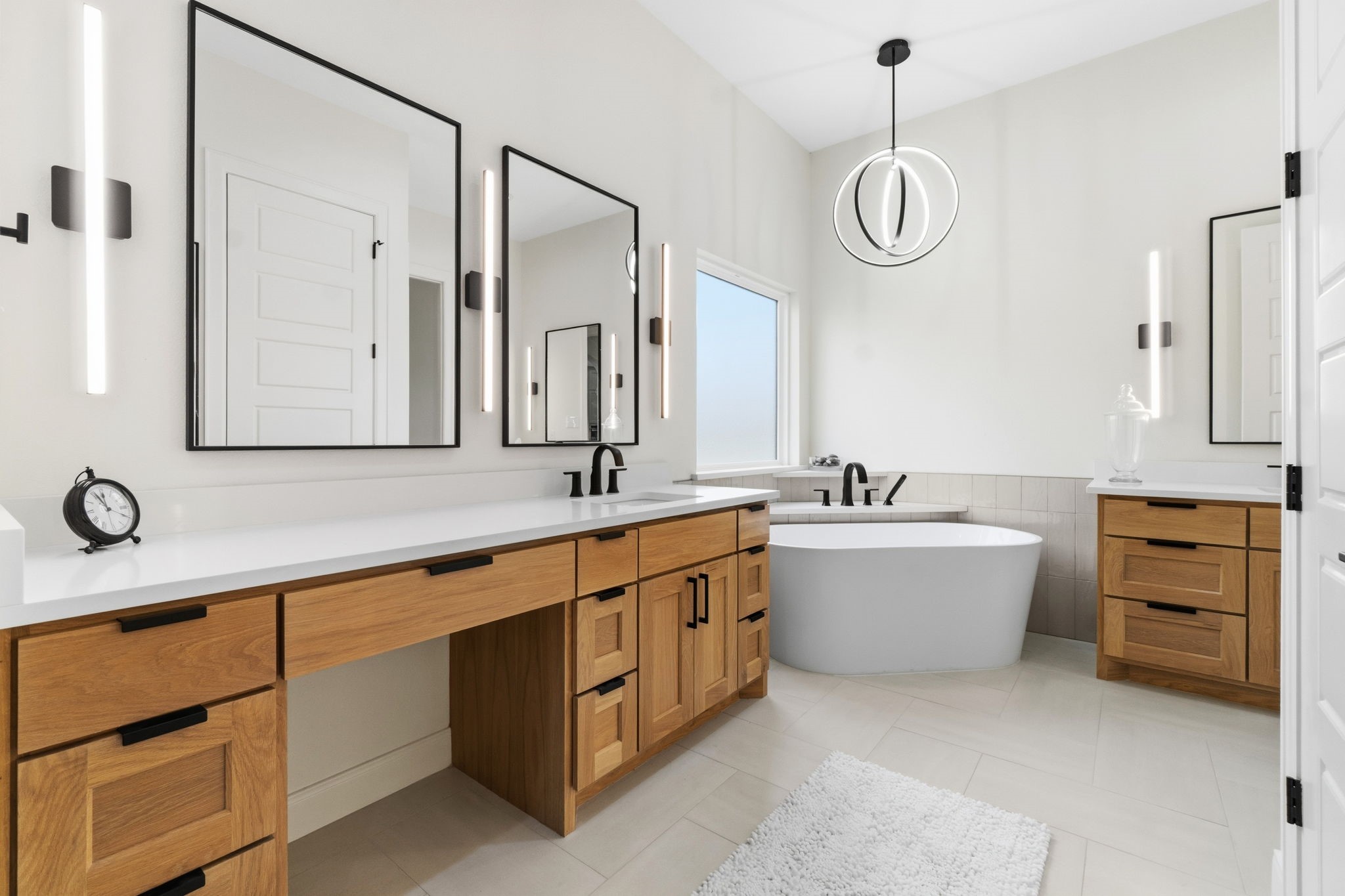 255 Peninsula Drive Livingston, TX 77351 - Photo 31 of 50 Spa inspired bathroom with dual vanities, walk-in shower and a stand-alone soaking tub.