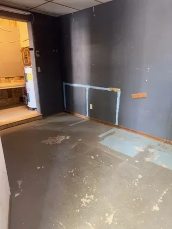 a view of an empty room with a window