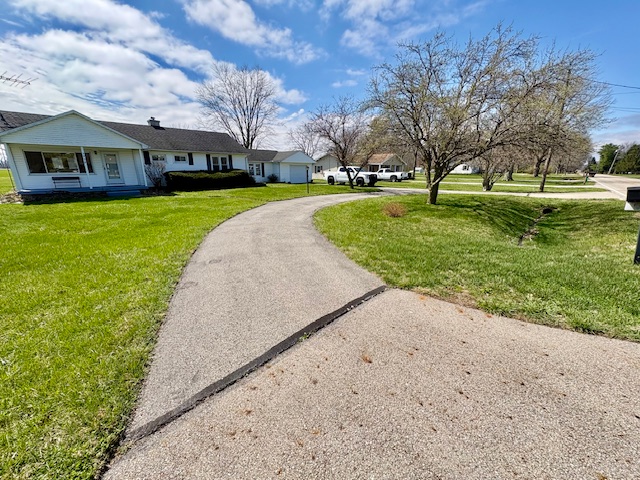 3079 Rocky Point Road Springfield, OH 45502 - Photo 37 of 37 This charming residence features a well-maintained driveway, inviting you to a serene and expansive yard.