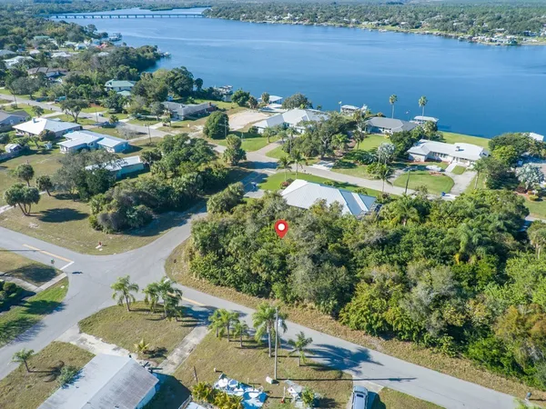 an aerial view of a houses with a lake view