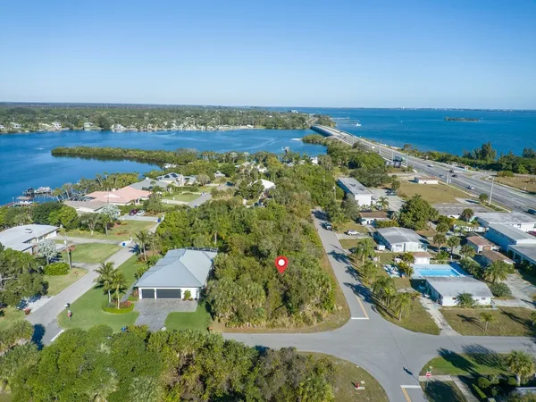 an aerial view of residential building and ocean view