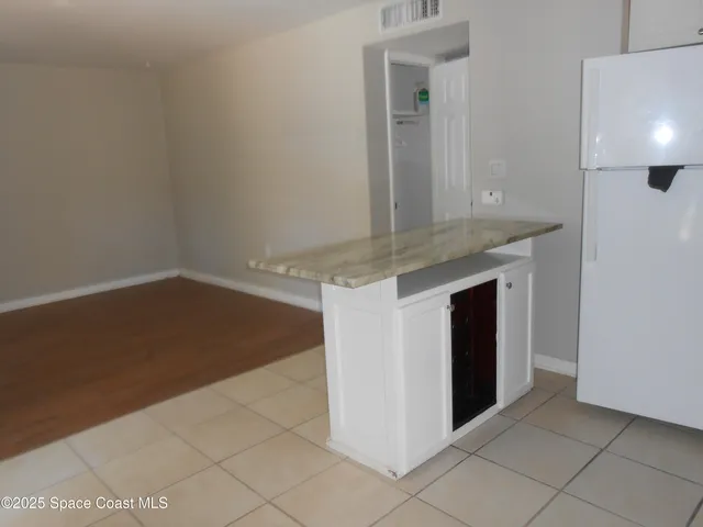a view of a kitchen with cabinets
