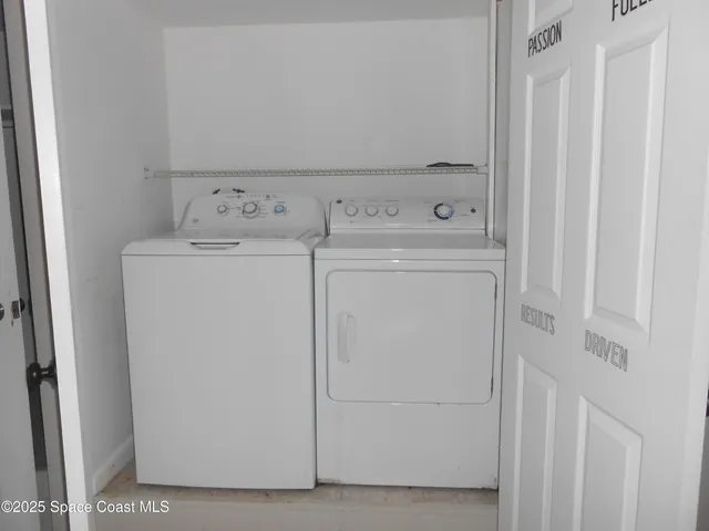 a utility room with dryer and washer