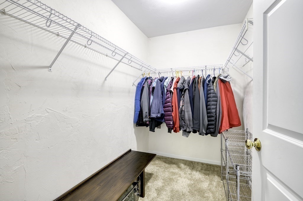 159 Allen Road, Unit 24 Billerica, MA 01821 - Photo 12 of 34 a view of walk in closet with clothes