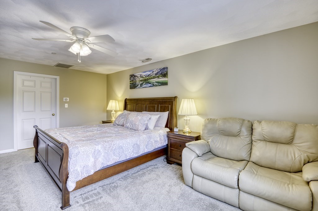 159 Allen Road, Unit 24 Billerica, MA 01821 - Photo 15 of 34 a bedroom with a bed and ceiling fan