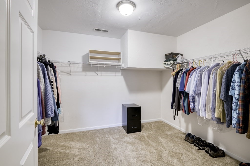 159 Allen Road, Unit 24 Billerica, MA 01821 - Photo 17 of 34 a view of walk in closet with clothes and shoes