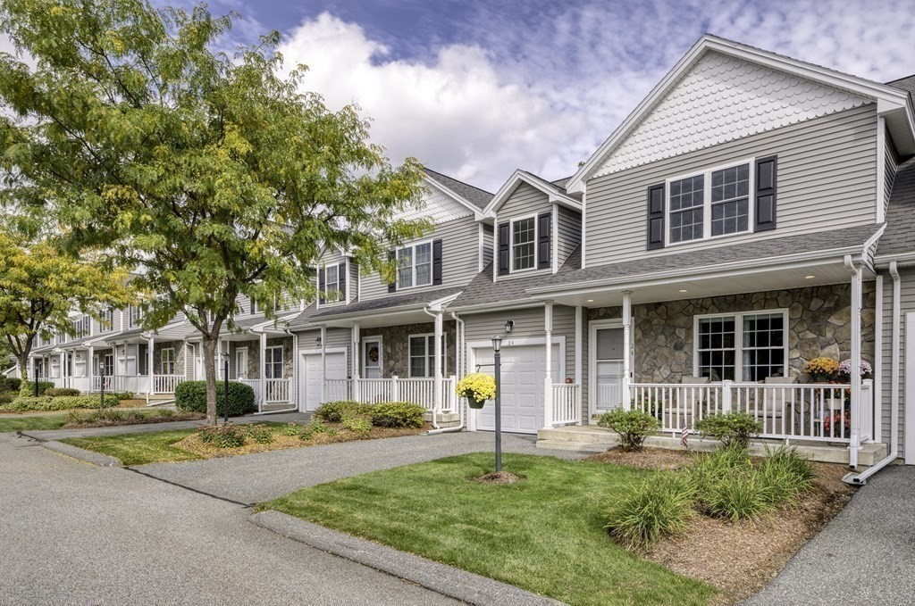 159 Allen Road, Unit 24 Billerica, MA 01821 - Photo 26 of 34 a front view of a house with swimming pool and porch