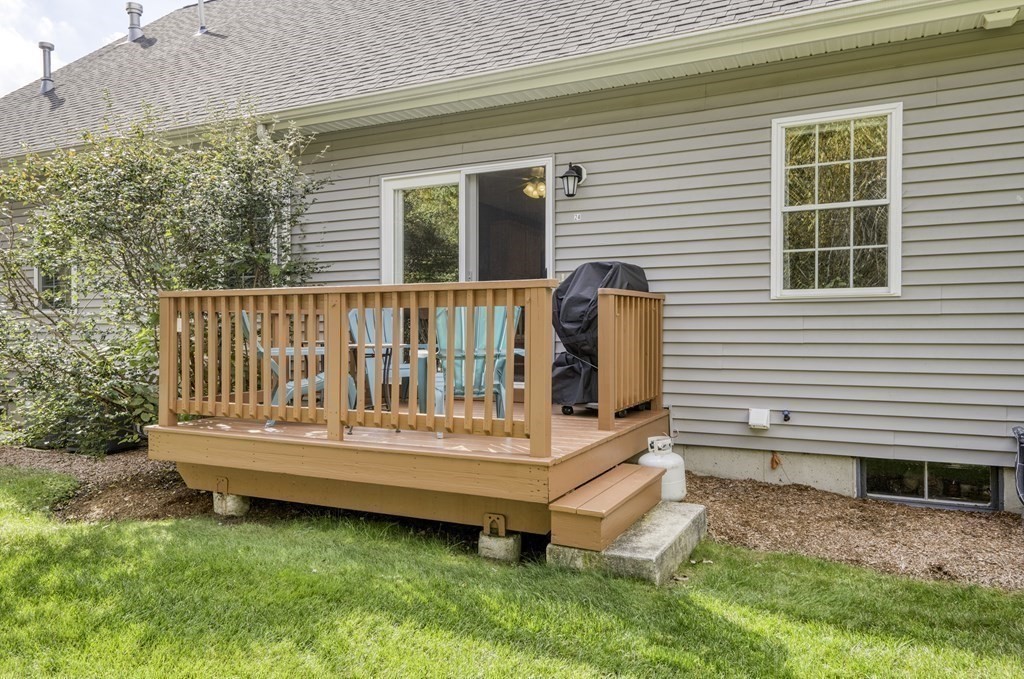 159 Allen Road, Unit 24 Billerica, MA 01821 - Photo 30 of 34 a view of a deck with a bench and wooden fence