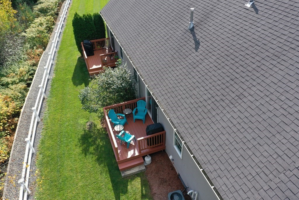 159 Allen Road, Unit 24 Billerica, MA 01821 - Photo 33 of 34 a backyard of a house with outdoor seating