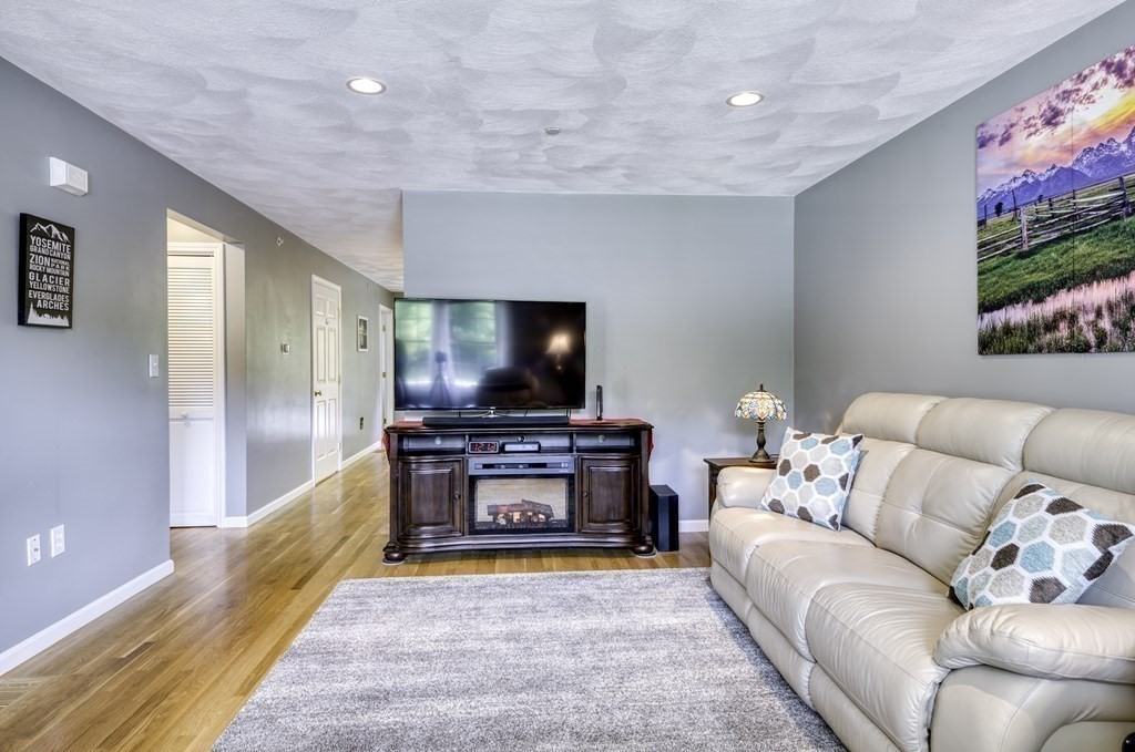 159 Allen Road, Unit 24 Billerica, MA 01821 - Photo 6 of 34 a living room with furniture and a flat screen tv